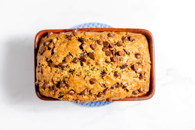 Baked zucchini bread in a loaf pan.