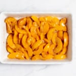 Peaches in a 9x13 baking dish.