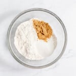 Sugar, brown sugar, flour in a mixing bowl.