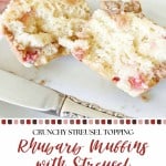 A sliced rhubarb muffin with streusel topping is shown on a plate, displaying its soft, crumbly center with visible fruit pieces—perfect for anyone who loves homemade rhubarb muffins.