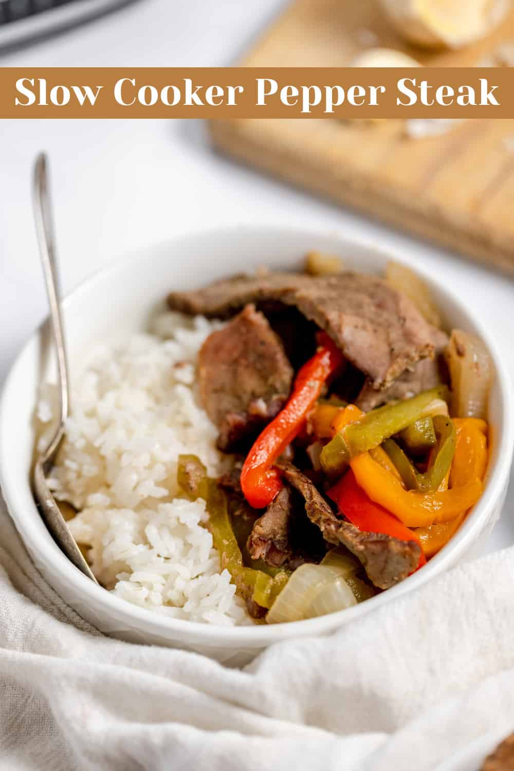 Pin Graphic for Slow cooker pepper steak with rice and peppers.