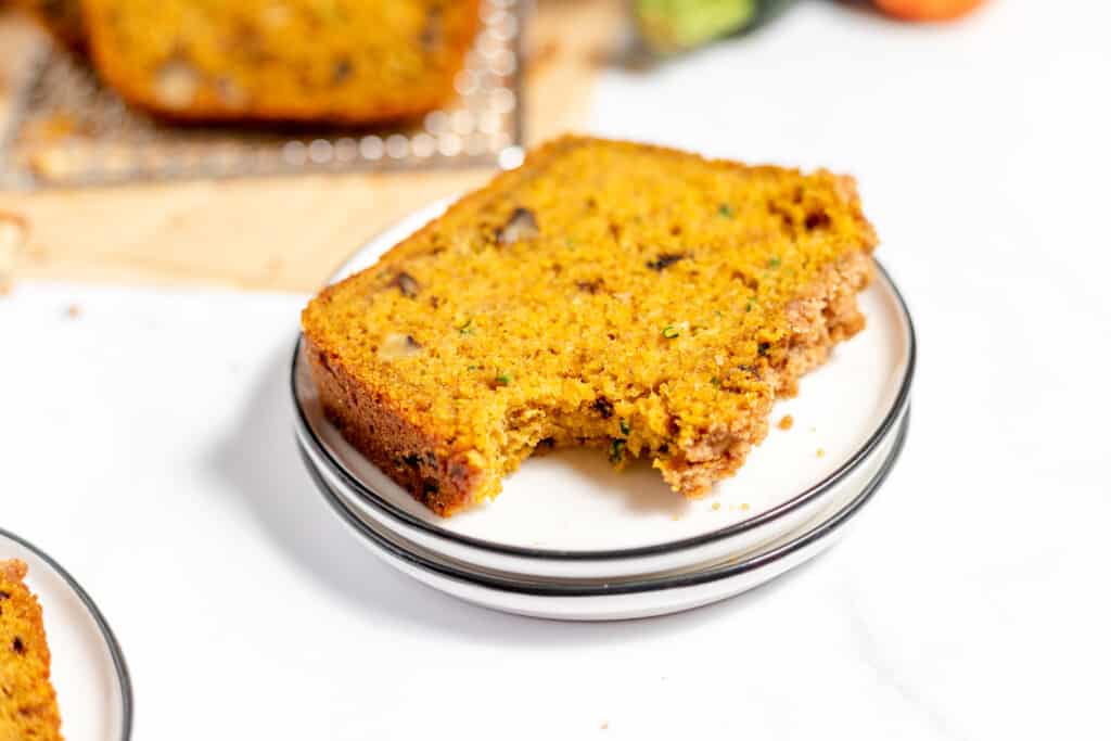 A slice of pumpkin bread on a plate.