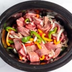 Beef and peppers in a crock pot.