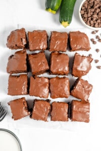 Chocolate zucchini brownies on a white plate.