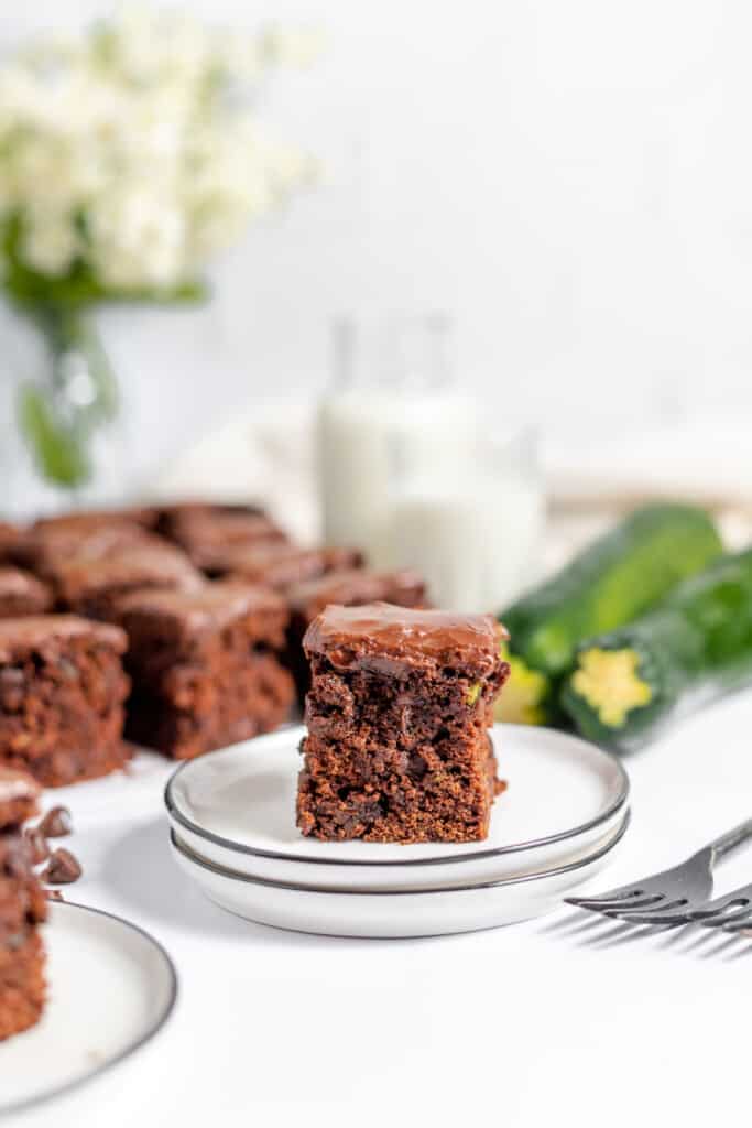 A slice of chocolate zucchini cake on a plate.