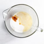 A glass bowl with a melted butter mixture in it.