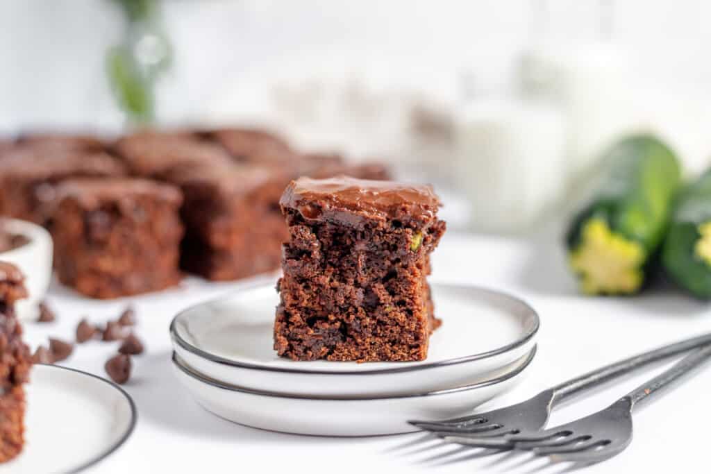 A slice of chocolate zucchini cake on a plate.