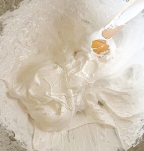 Marshmallow with a wooden spoon.