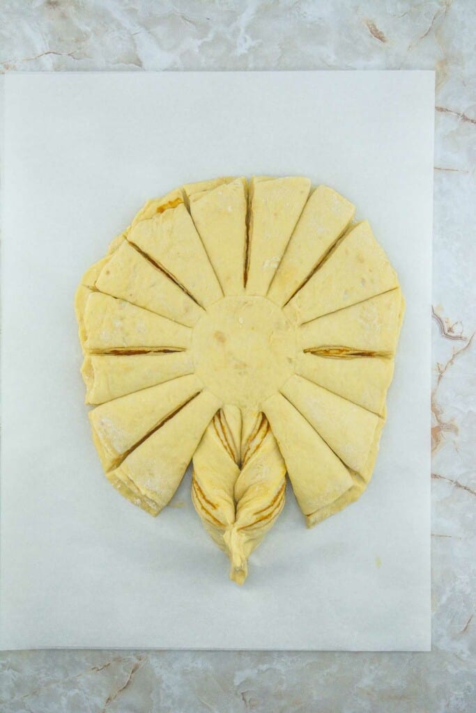 A piece of dough cut into the shape of a flower.