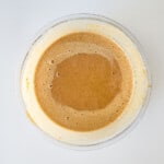 A bowl of mashed sweet potato cake batter.