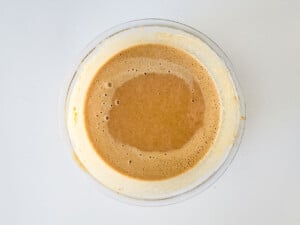 A bowl of mashed sweet potato cake batter.