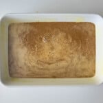 A white baking dish with sweet potato in it.