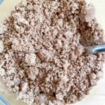 A bowl filled with a mixture of brown sugar and cinnamon.