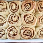 Cinnamon rolls in a baking dish.
