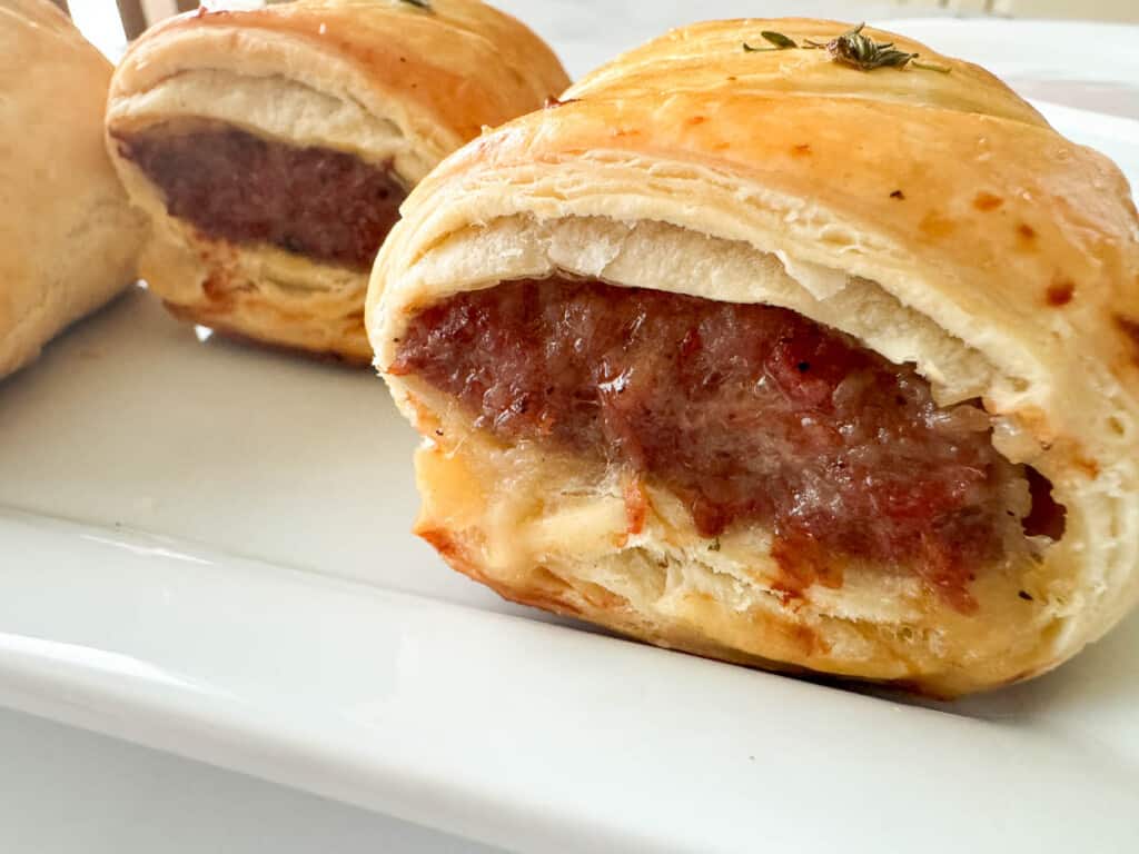 Sausage rolls on a plate.