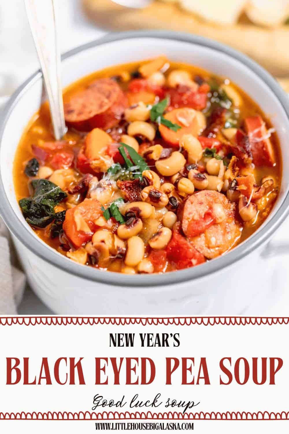 A hearty bowl of black eyed pea soup with sausage, tomatoes, and greens, garnished with fresh herbs. Text below reads: "New Year's Black Eyed Pea Soup – Good luck soup.