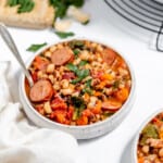Two bowls of black eyed pea and sausage stew.