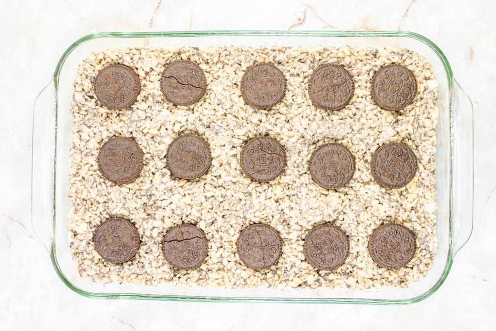 A glass baking dish filled with cookies and oats.