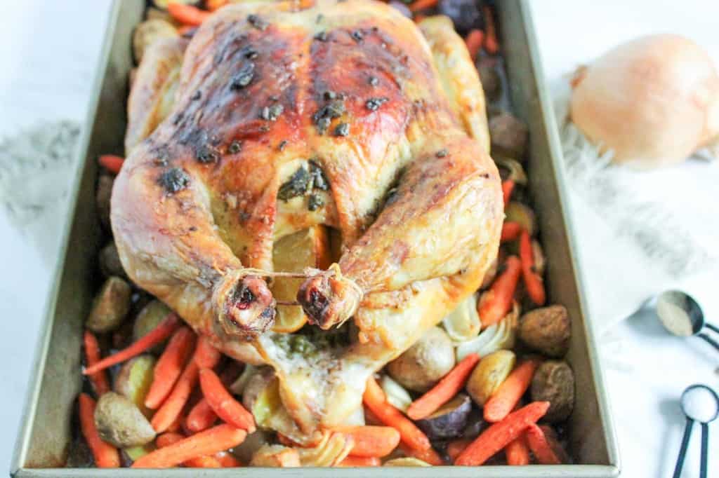 Keywords used: Roasted ChickenDescription: A flavorful roasted chicken with tender carrots and potatoes, all cooked to perfection in a pan.