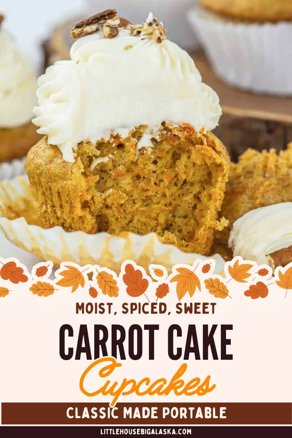 A carrot cake cupcake with cream cheese frosting is cut in half, showing its moist interior. Decorative fall leaves border the image. Text reads, “Carrot Cake Cupcakes, Classic Made Portable.” These irresistible carrot cake cupcakes capture all the cozy flavors of a classic dessert in every bite.