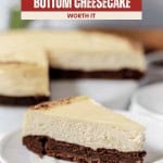 A slice of decadent brownie bottom cheesecake rests on a plate, showcasing its rich layers, with the whole brownie bottom cheesecake displayed invitingly in the background.