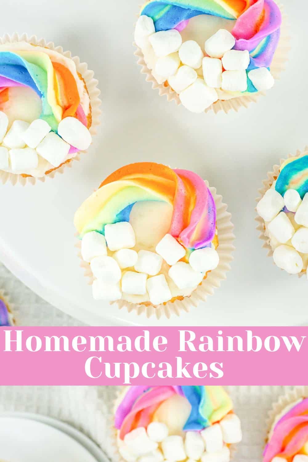 Colorful homemade rainbow cupcakes decorated with marshmallows.