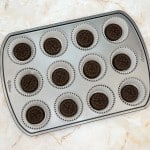 Cookie added to each liner of the pan for mini cookies and cream cheesecakes.