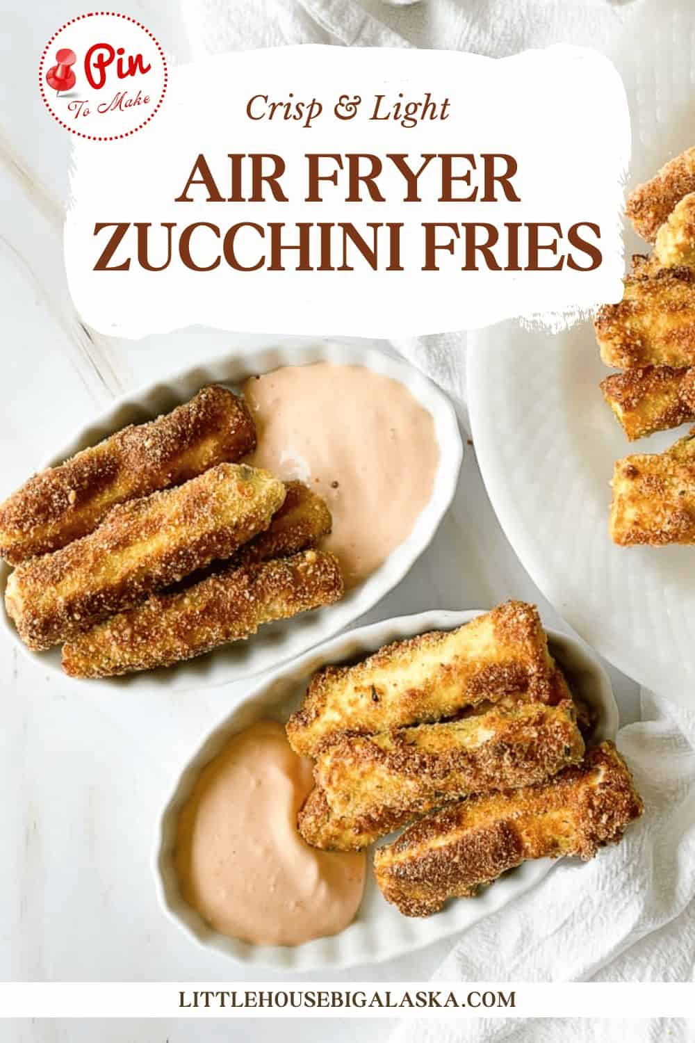 Air fryer zucchini fries in a white dish, served with a side of dipping sauce, on a table with a textual overlay promoting the recipe.