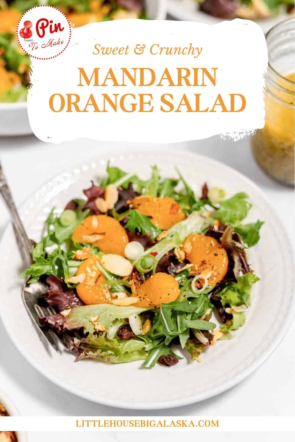 Fresh mandarin orange salad with leafy greens and almond slices, perfect for a healthy meal.