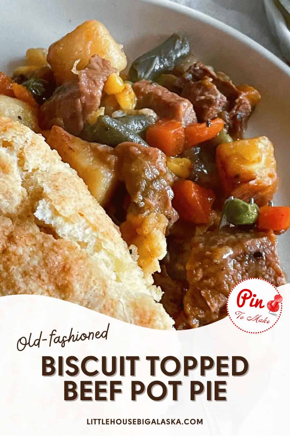 Close-up of a serving of biscuit-topped beef pot pie with chunks of beef, vegetables, and a biscuit, displayed on a white plate with a logo and text on the image promoting the dish.