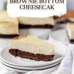 A double-decker brownie bottom cheesecake slice on a white plate, with a text overlay describing the dessert.