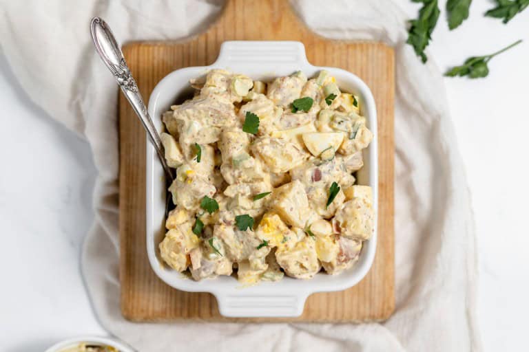 A bowl of mustard potato salad.