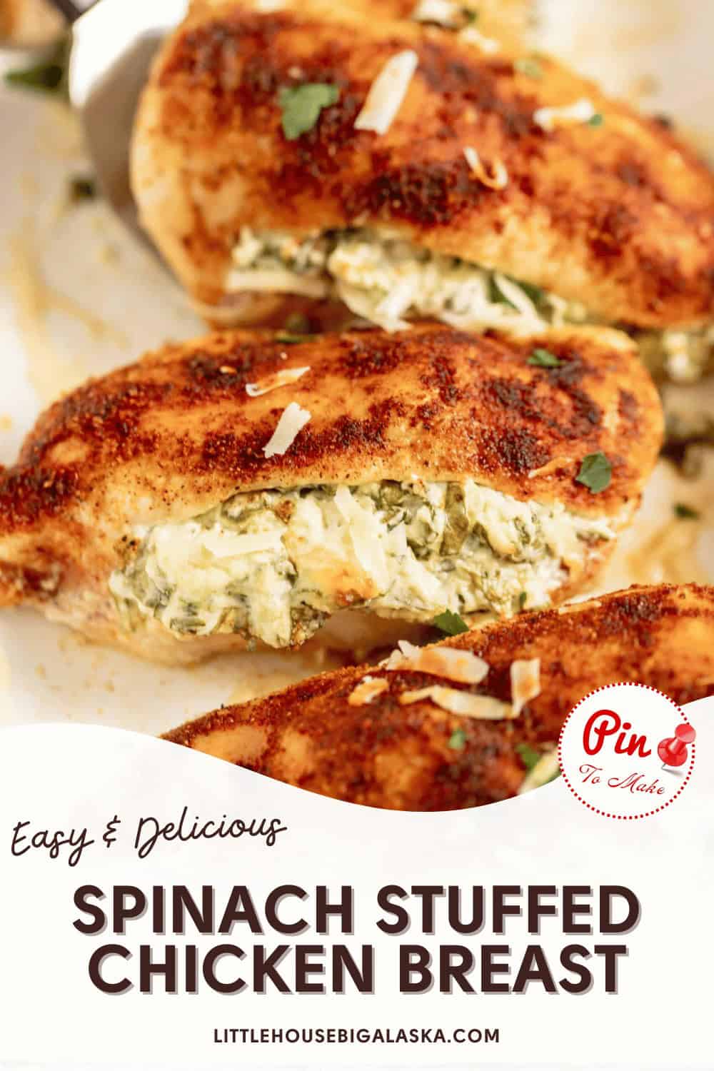 Close-up of spinach-stuffed chicken breasts with seasoning, served on a plate. Text reads: "Easy & Delicious Spinach Stuffed Chicken Breast. LittleHouseBigAlaska.com.