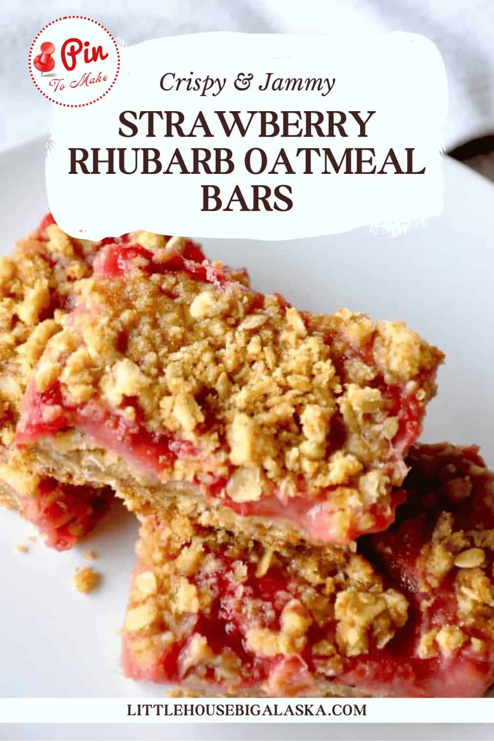 Close-up of two strawberry rhubarb oatmeal bars with a crumbly topping on a white plate. Text overlay includes a recipe name and the website littlehousebigalaska.com.