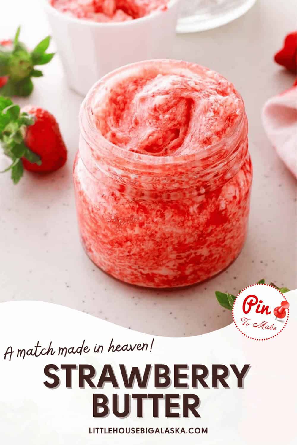 A jar of strawberry butter on a table with fresh strawberries nearby. Text reads "A match made in heaven! Strawberry Butter.