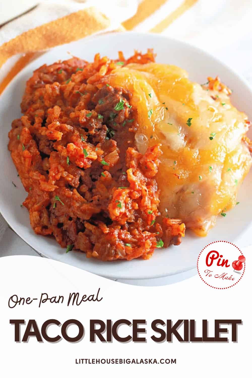 A plate of taco rice skillet with a mix of seasoned ground meat, rice, and melted cheese.