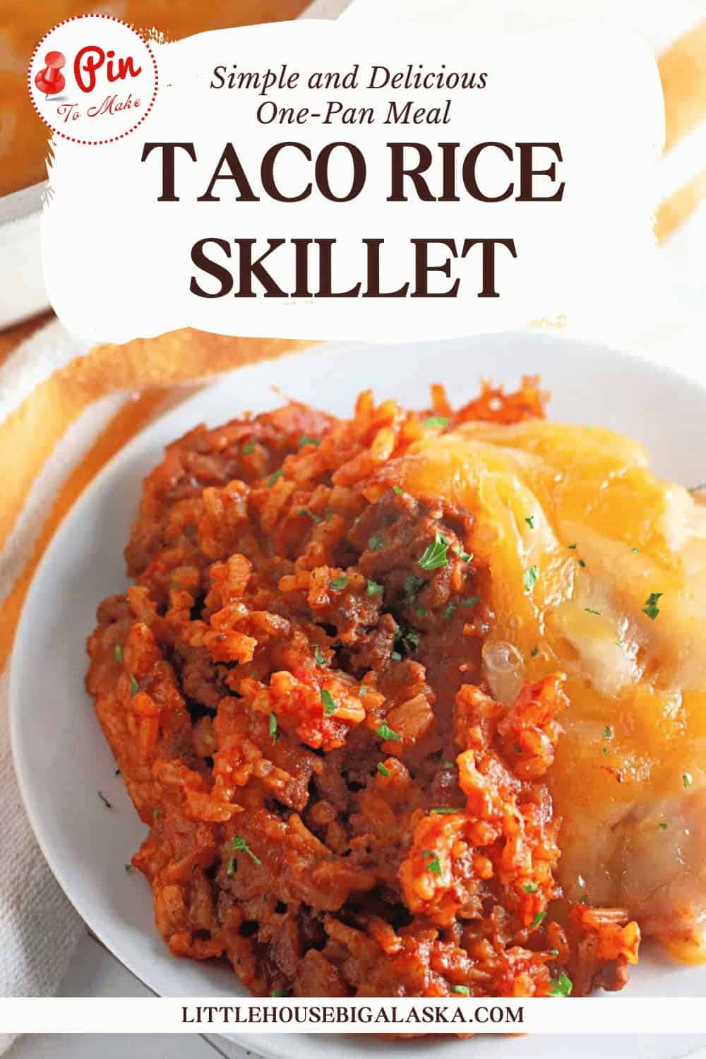 Plate of taco rice skillet with ground meat and rice, topped with cheese and herbs.