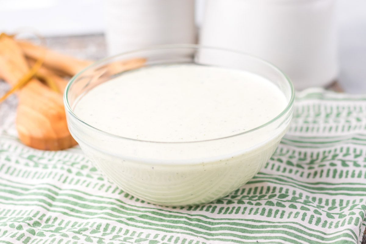 A bowl of salad dressing.