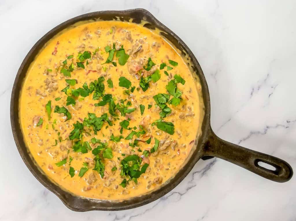 Cheesy dip in a cast iron skillet. 