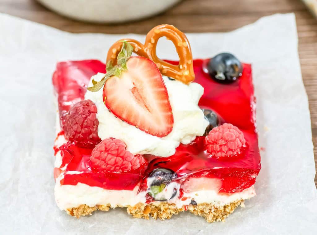 A slice of mixed berry pretzel salad.