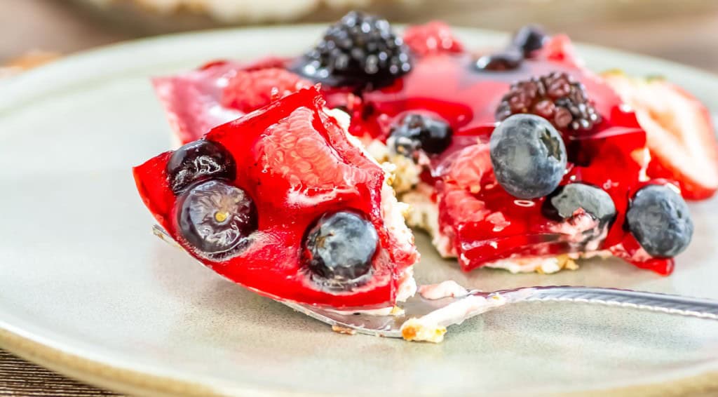 A slice of mixed berry pretzel salad.