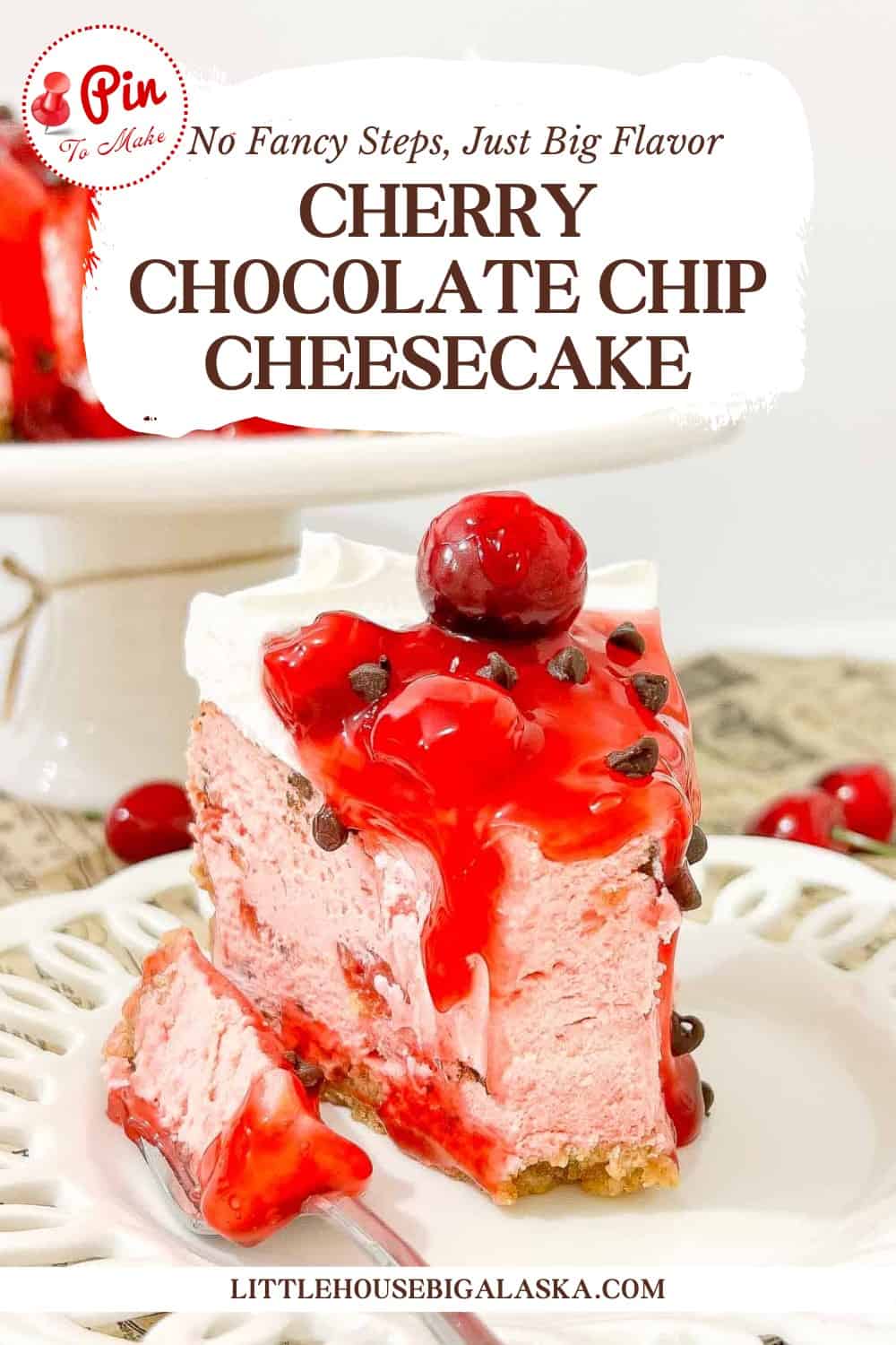 A slice of cherry chocolate chip cheesecake topped with whipped cream, cherries, and cherry sauce on a white plate.