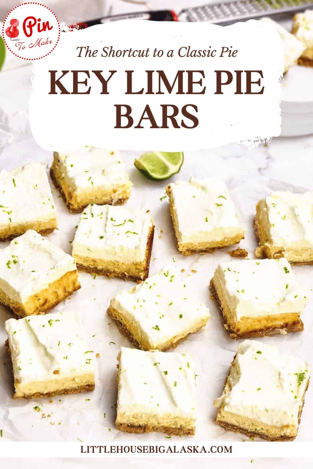 Sliced key lime pie bars with creamy topping and lime zest are arranged on a white surface, with a slice of lime in the background.