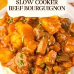 Close-up of Slow Cooker Beef Bourguignon with potatoes, carrots, and mushrooms in a rich sauce, served atop mashed potatoes. Text overlay promotes the recipe as "Classic French Made Simple.