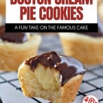 A close-up of Boston Cream Pie Cookies with creamy filling and chocolate topping on a cooling rack, with text overlay highlighting the decadent Boston Cream Pie Cookie flavor.