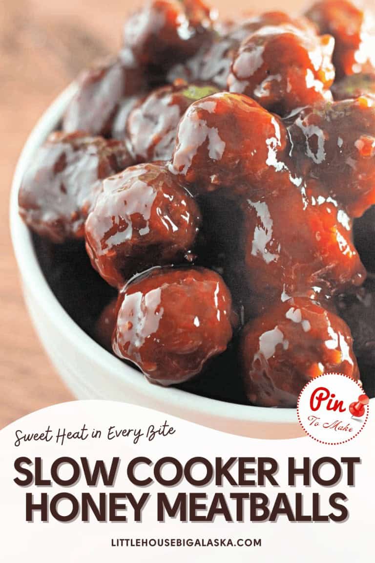 A close-up of Slow Cooker Hot Honey Meatballs in a white bowl, with text promoting this sweet and spicy recipe from littlehousebigalaska.com.