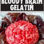 A red brain-shaped gelatin dessert sits on red lettuce leaves, with the text "Creepy & Cool Halloween Dessert Bloody Brain Gelatin" above.