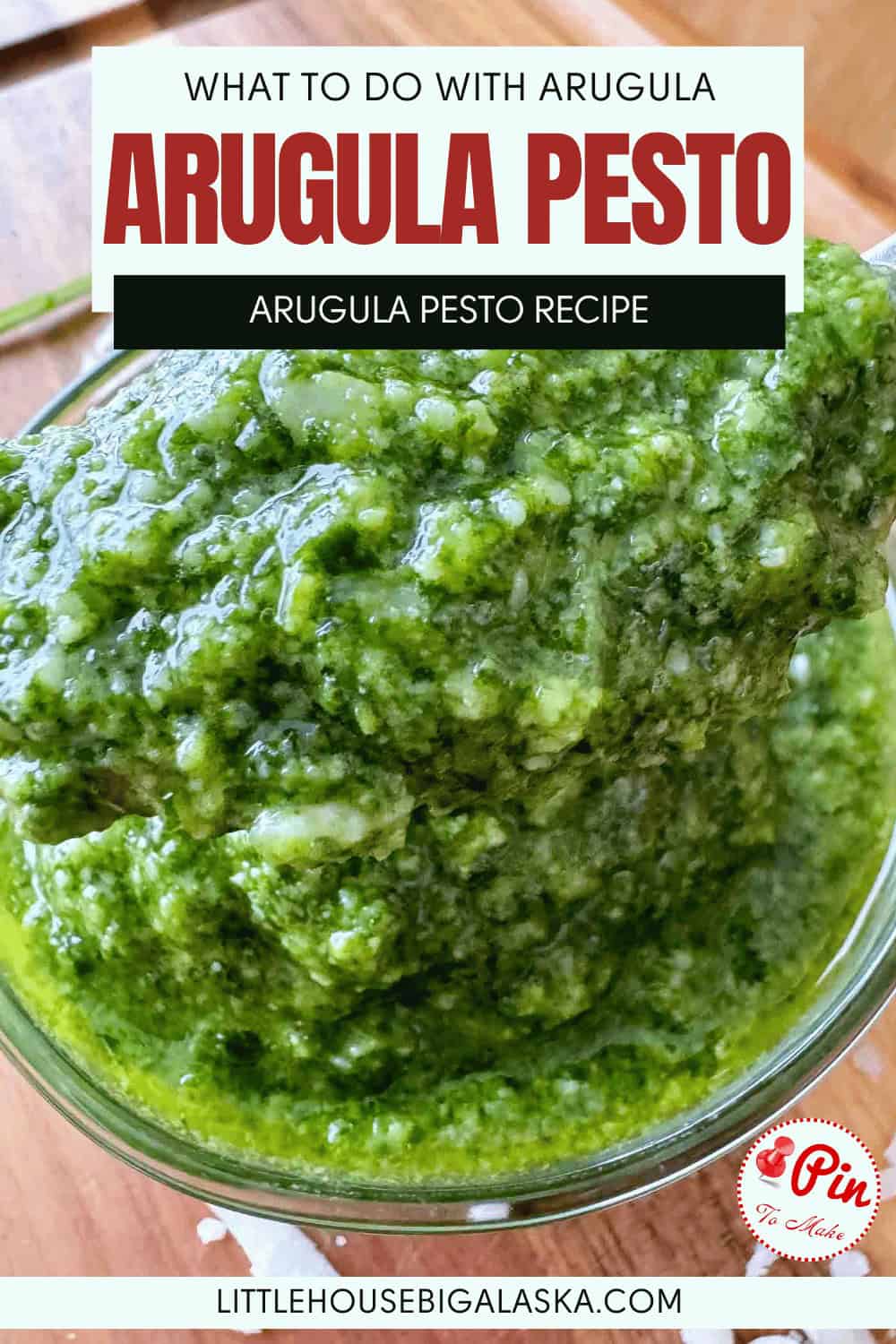 A close-up of a glass bowl filled with vibrant arugula pesto, with text above reading "What to do with arugula: Arugula Pesto, Arugula Pesto Recipe.