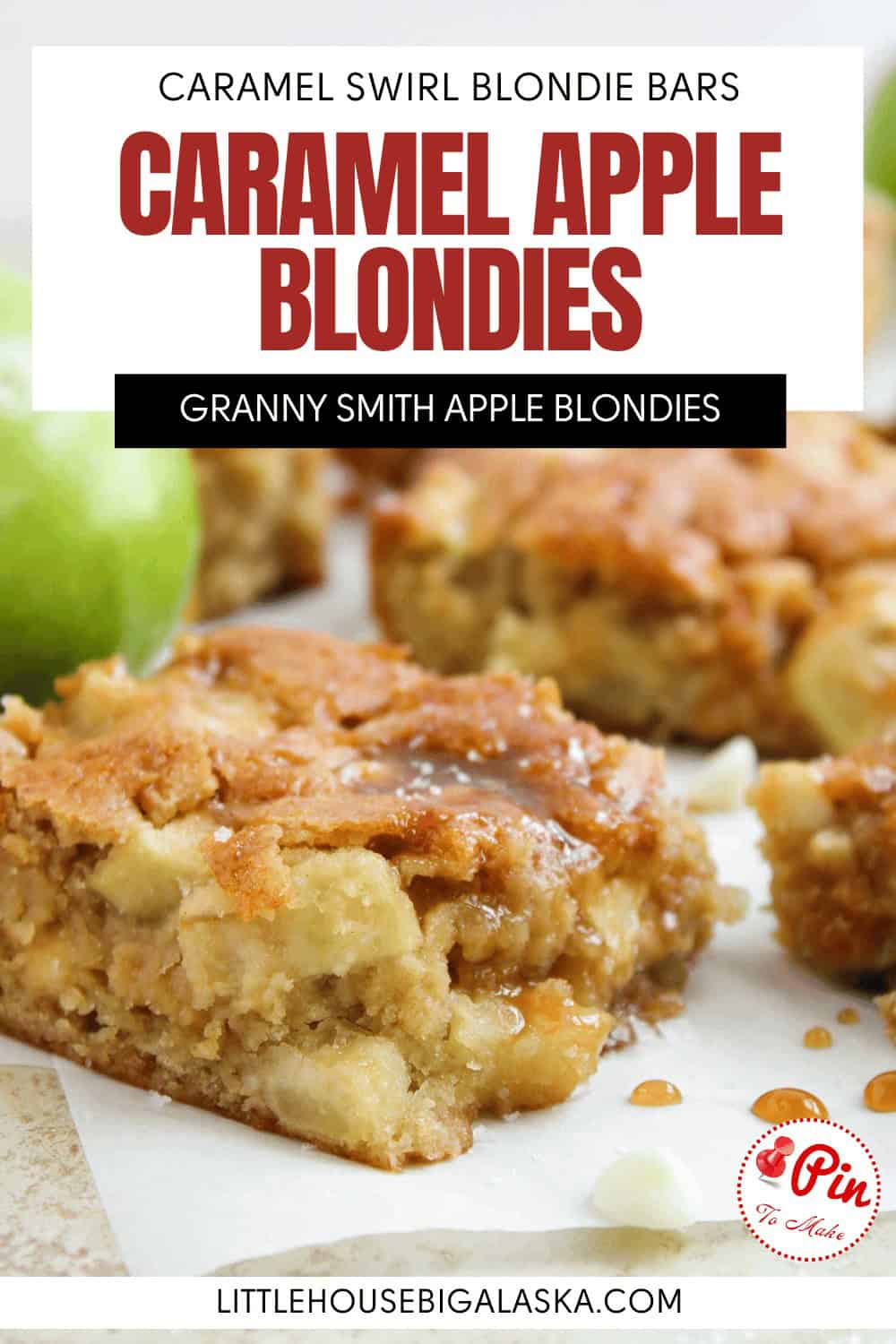 Close-up of caramel apple blondie bars with visible apple chunks, a golden-brown top, and pieces arranged on a white surface. Green apples are blurred in the background.