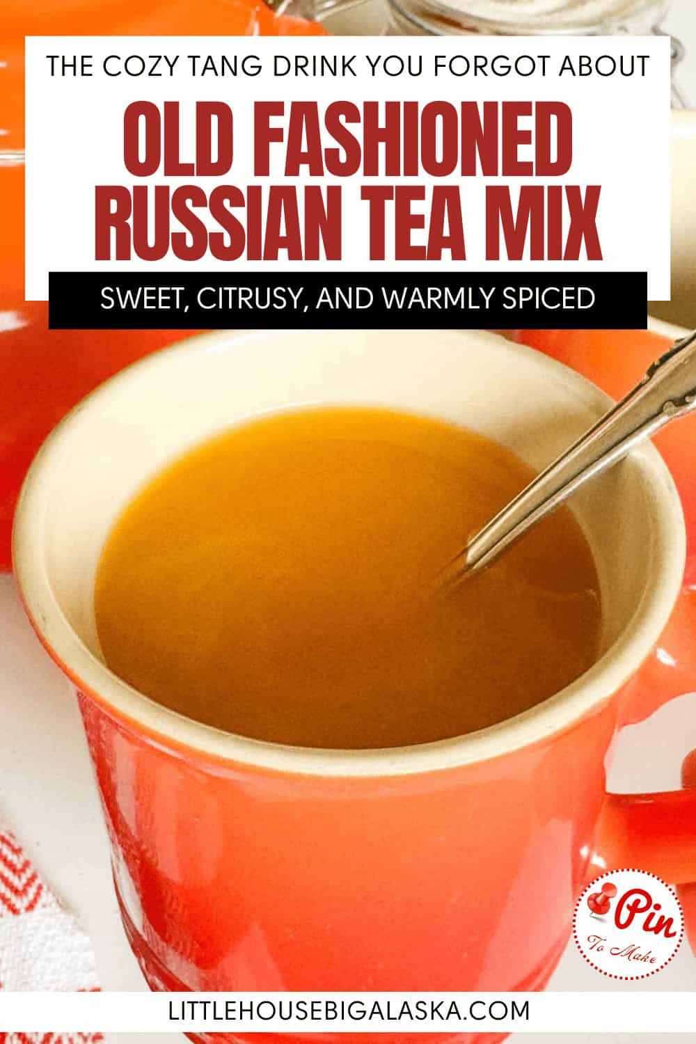 A mug of orange Russian tea mix with a spoon, with text overlay reading “Old Fashioned Russian Tea Mix.”